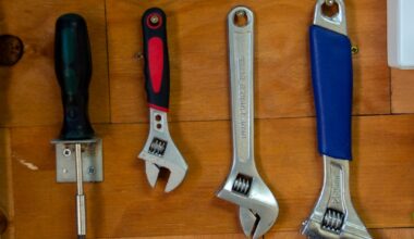 a bunch of tools are hanging on a wall