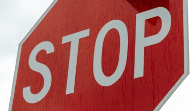 a red sign with white letters